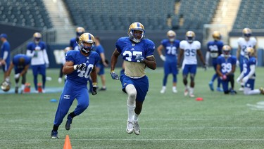 Defensive back Brandon Alexander (right) and linebacker Frank Renaud chase downfield during a special teams drill at Winnipeg Blue Bombers training camp at Investors Group Field in Winnipeg on Wed., May 23, 2018. Kevin King/Winnipeg Sun/Postmedia Network