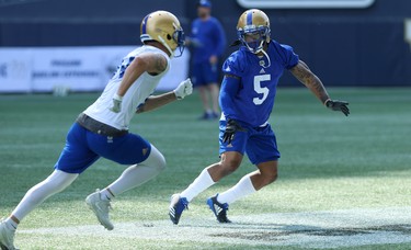 Defensive back Brian Walker (right) covers receiver Myles White during Winnipeg Blue Bombers training camp at Investors Group Field in Winnipeg on Wed., May 23, 2018. Kevin King/Winnipeg Sun/Postmedia Network