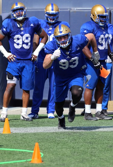 Defensive lineman Craig Roh charges a cone during a drill at Winnipeg Blue Bombers training camp at Investors Group Field in Winnipeg on Wed., May 23, 2018. Kevin King/Winnipeg Sun/Postmedia Network