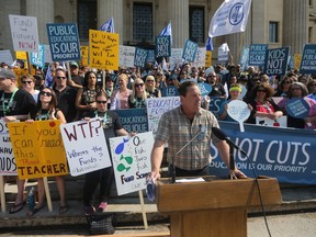 Norm Gould, president of the Manitoba Teachers' Society, addresses a rally at the Manitoba Legislature on Friday.
