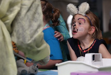 Keegan Abel, 6, watches as her stuffy is checked out during the 32nd annual Teddy Bears' Picnic, in support of the Children's Hospital Foundation of Manitoba, at Assiniboine Park in Winnipeg on Sun., May 27, 2018. Kevin King/Winnipeg Sun/Postmedia Network
