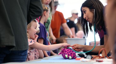 Noura, 5, has her stuffy looked over during the 32nd annual Teddy Bears' Picnic, in support of the Children's Hospital Foundation of Manitoba, at Assiniboine Park in Winnipeg on Sun., May 27, 2018. Kevin King/Winnipeg Sun/Postmedia Network