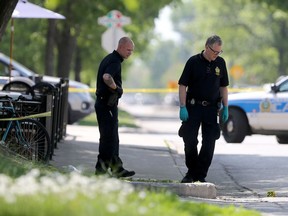 Winnipeg police on Tuesday investigate a shooting that took place in the vicinity of Cockburn Street and McMillan Avenue. Two people were shot and one victim has died. Chris Procaylo/Winnipeg Sun
