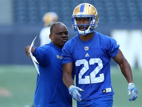 Defensive co-ordinator Richie Hall (left) directs Chandler Fenner during Winnipeg Blue Bombers training camp at Investors Group Field in Winnipeg on Mon., May 28, 2018. Kevin King/Winnipeg Sun/Postmedia Network