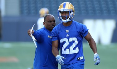 Defensive co-ordinator Richie Hall (left) directs Chandler Fenner during Winnipeg Blue Bombers training camp at Investors Group Field in Winnipeg on Mon., May 28, 2018. Kevin King/Winnipeg Sun/Postmedia Network