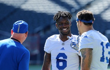 Corey Washington (centre) chats with fellow receiver Rashaun Simonise (right) during Winnipeg Blue Bombers training camp at Investors Group Field in Winnipeg on Mon., May 28, 2018. Kevin King/Winnipeg Sun/Postmedia Network