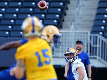 Weston Dressler awaits a screen pass from Matt Nichols during Winnipeg Blue Bombers training camp at Investors Group Field in Winnipeg on Mon., May 28, 2018. Kevin King/Winnipeg Sun/Postmedia Network