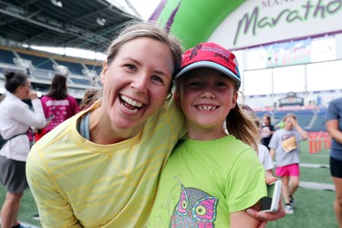 Amy Andersen of Oakbank and her seven-year-old daugther, Gracie, are all smiles after the mother-daughter duo completed the super run at the 40th annual Manitoba Marathon in Winnipeg, Man., on Sunday, June 17, 2018. Brook Jones/Postmedia Network)
