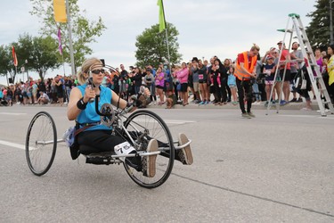 Kristine Cowley from East St. Paul gets rolling at the start of the half marathon wheelchair race at the 40th annual Manitoba Marathon in Winnipeg, Man., on Sunday, June 17, 2018. (Brook Jones/Postmedia Network)