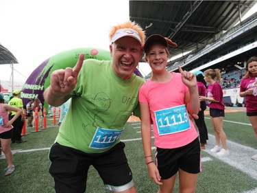 Chris Courchaine and Kate Courchaine having fun after crossing the finishing line in the super run at the 40th annual Manitoba Marathon in Winnipeg, Man., on Sunday, June 17, 2018. (Brook Jones/Postmedia Network)