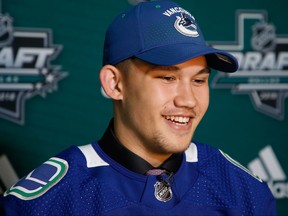 DALLAS, TX - JUNE 23:  Jett Woo speaks to the media after being selected 37th overall by the Vancouver Canucks during the 2018 NHL Draft at American Airlines Center on June 23, 2018 in Dallas, Texas.  (Photo by Ron Jenkins/Getty Images)