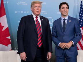 U.S. President Donald Trump and Canadian Prime Minister Justin Trudeau hold a meeting on the sidelines of the G7 Summit in La Malbaie, Quebec, June 8, 2018. (SAUL LOEBSAUL LOEB/AFP/Getty Images)