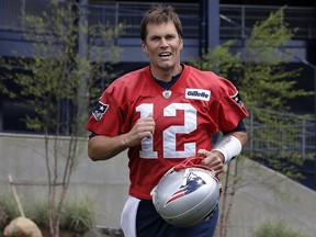 New England Patriots quarterback Tom Brady steps onto the field at the start of minicamp practice, Tuesday, June 5, 2018, in Foxborough, Mass. (AP Photo/Steven Senne)