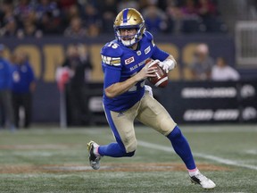 Winnipeg Blue Bombers quarterback Matt Nichols (15) looks for his receivers during the first half of CFL action against the Hamilton Tiger-Cats in Winnipeg Friday, October 6, 2017. Quarterback Matt Nichols and the Winnipeg Blue Bombers no longer have the element of surprise in the West Division.THE CANADIAN PRESS/John Woods ORG XMIT: CPT134