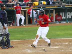 Goldeyes catcher Kevin Garcia (right) had a .357 batting average entering Friday.