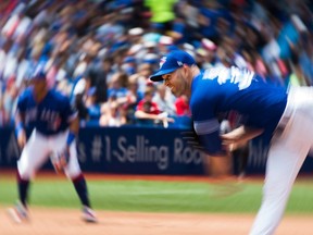 Toronto Blue Jays starting pitcher J.A. Happ works against the Atlanta Braves during seventh inning Interleague baseball action in Toronto on Wednesday, June 20, 2018.