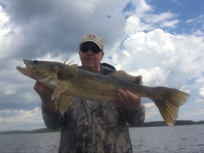 Angler shows off his prize trophy walleye caught at Budd's Gunisao Lake Lodge. Gunisao is a short 75 minute flight from Winnipeg.