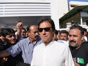 Pakistan opposition leader and head of the Pakistan Tehreek-e-Insaf (PTI - Pakistan Movement for Justice) political party Imran Khan leaves Parliament after attending a session in Islamabad on May 23, 2018.