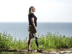Captain Kimberly Fawcett Smith stands at the Scarborough Bluffs, Wednesday May 30, 2018. For a decade, she has been in a battle with the Canadian Armed Forces to pay for prosthetics she needed after a horrific car crash that also killed her son.