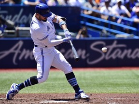 Blue Jays batter Randal Grichuk hits a solo home run against the Nationals during second inning MLB action in Toronto on Sunday, June 17, 2018.