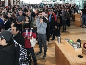 The security line-up at the Winnipeg Richardson International Airport after passengers and employees were evacuated early Sunday morning due to what airport officials were calling a "possible security incident".