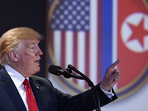 U.S. President Donald Trump answers questions about the summit with North Korea leader Kim Jong Un during a press conference at the Capella resort on Sentosa Island Tuesday, June 12, 2018 in Singapore.