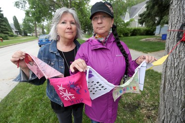 Christine Dobbs (left), and Arlene Last-Kolb have made flags to remember people who have died from, or are struggling with drug related issues.  .  Saturday, June 02, 2018.   Sun/Postmedia Network