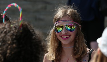 Grace Findlay gathers with friends during the Pride Day rally on the Manitoba Legislative Building grounds in Winnipeg on Sun., June 3, 2018. Kevin King/Winnipeg Sun/Postmedia Network