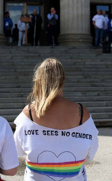 A woman uses her shirt as a message board during the Pride Day rally on the Manitoba Legislative Building grounds in Winnipeg on Sun., June 3, 2018. Kevin King/Winnipeg Sun/Postmedia Network