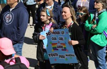 Members of honorary youth marshall Janine Brown look on during her speech at the Pride Day rally on the Manitoba Legislative Building grounds in Winnipeg on Sun., June 3, 2018. Kevin King/Winnipeg Sun/Postmedia Network