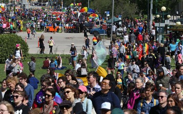People gather for the Pride Day rally on the Manitoba Legislative Building grounds while others gather along the parade route on Memorial Boulevard in Winnipeg on Sun., June 3, 2018. Kevin King/Winnipeg Sun/Postmedia Network