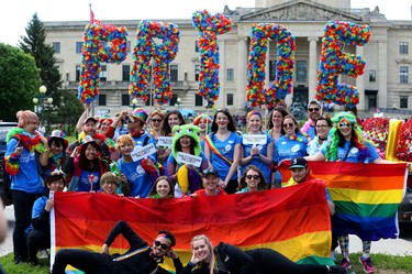 Manitoba Liquor and Lotteries float members gather for a photo prior to the Pride Day parade near the Manitoba Legislative Building in Winnipeg on Sun., June 3, 2018. Kevin King/Winnipeg Sun/Postmedia Network