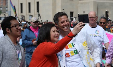 Mayor Brian Bowman stops to pose in a selfie during the Pride Day parade on York Avenue in Winnipeg on Sun., June 3, 2018. Kevin King/Winnipeg Sun/Postmedia Network