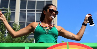 A woman dances on a float during the Pride Day parade on York Avenue in Winnipeg on Sun., June 3, 2018. Kevin King/Winnipeg Sun/Postmedia Network