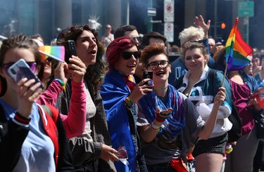Attendees celebrate during the Pride Day parade on York Avenue in Winnipeg on Sun., June 3, 2018. Kevin King/Winnipeg Sun/Postmedia Network