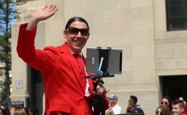 Liberal MP Robert-Falcon Ouellette waves from a float during the Pride Day parade on York Avenue in Winnipeg on Sun., June 3, 2018. Kevin King/Winnipeg Sun/Postmedia Network