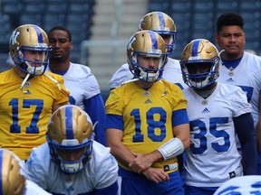 Chris Streveler (17) and Alex Ross (18) watch during Winnipeg Blue Bombers training camp on Wed., June 6, 2018. Kevin King/Winnipeg Sun/Postmedia Network