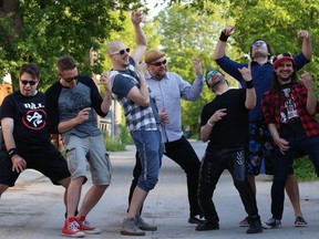 Mike Dedly, Damian Ray Nichols, Jeff Laird, Mr. Miles, Eric Nordquist, Mike Milner and Tristan Rivers shred a cacophony of air guitar solos on Wed., June 7, 2018. They will perform at the Windsor Hotel on Saturday, Bill and Ted Day, as the Wyld Stallyns.  Kevin King/Winnipeg Sun/Postmedia Network