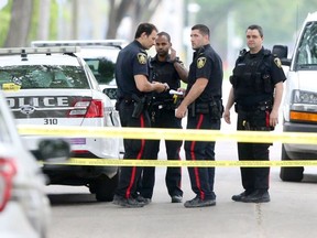 Winnipeg Police made numerous weapons related arrests over the weekend, including one arrest that involved a man who was armed with an improvised firearm, in the North End.  Officers investigate a scene on Andrews Street just south of Redwood Avenue.   Saturday, June 09, 2018.   Sun/Postmedia Network