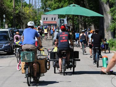 Participants in the Fam Jam Wheel Jam head north on Raglan Road toward Portage Avenue in Winnipeg on Sun., June 10, 2018. Kevin King/Winnipeg Sun/Postmedia Network