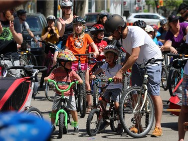Riders are positioned on Wolseley Avenue for the Fam Jam Wheel Jam in Winnipeg on Sun., June 10, 2018. Kevin King/Winnipeg Sun/Postmedia Network