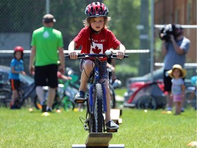 Allen Olschevski, 7, tackles an obstacle at Mulvey School during the Fam Jam Wheel Jam on Sunday.