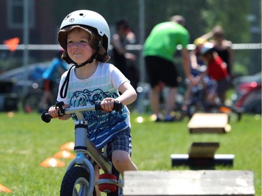 A youngster bypasses an obstacle at Mulvey School during the Fam Jam Wheel Jam in Winnipeg on Sun., June 10, 2018. Kevin King/Winnipeg Sun/Postmedia Network