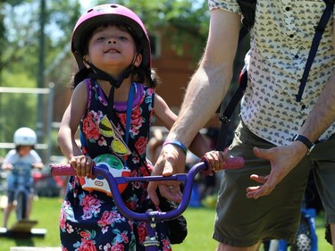 Hazel Pancoe, 4, gets help from dad on the obstacle course at Mulvey School during the Fam Jam Wheel Jam in Winnipeg on Sun., June 10, 2018. Kevin King/Winnipeg Sun/Postmedia Network