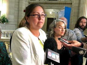 Liberal MLA Judy Klassen (Kewatinook) addresses the media beside NDP MLA Nahanni Fontaine (St. Johns) at the Manitoba Legislative Building in Winnipeg on Tuesday. Klassen alleges that she felt threatened and intimidated by Premier Brian Pallister in the Legislature and that she was "shot down" after trying to confide in the provincial minister for the status of women Rochelle Squires earlier this year.