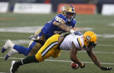 Edmonton Eskimos' C.J.Gable (2) attempts to make a catch under coverage from Winnipeg Blue Bombers' Jovan Santos-Knox (45) during CFL action in Winnipeg today.   Thursday, June 14, 2018.   Sun/Postmedia Network