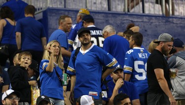 Fans exit their seats after a weather warning delayed the CFL game between the Winnipeg Blue Bombers and Edmonton Eskimos in Winnipeg on Thurs., June 14, 2018. Kevin King/Winnipeg Sun/Postmedia Network