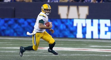 Edmonton Eskimos QB Mike Reilly runs in the open field  during CFL action against the Winnipeg Blue Bombers in Winnipeg on Thurs., June 14, 2018. Kevin King/Winnipeg Sun/Postmedia Network