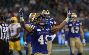 Winnipeg Blue Bombers LB Jovan Santos-Know celebrates his sack of Edmonton Eskimos QB Mike Reilly during CFL action in Winnipeg on Thurs., June 14, 2018. Kevin King/Winnipeg Sun/Postmedia Network