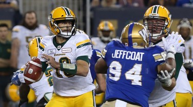 Edmonton Eskimos QB Mike Reilly looks for an open receiver during CFL action against the Winnipeg Blue Bombers in Winnipeg on Thurs., June 14, 2018. Kevin King/Winnipeg Sun/Postmedia Network